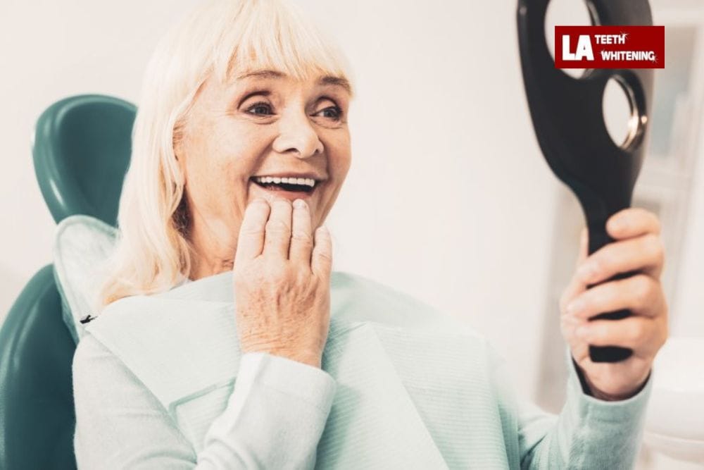 older person smiling, showing natural yellowing of teeth due to aging Hemel-Hempstead
